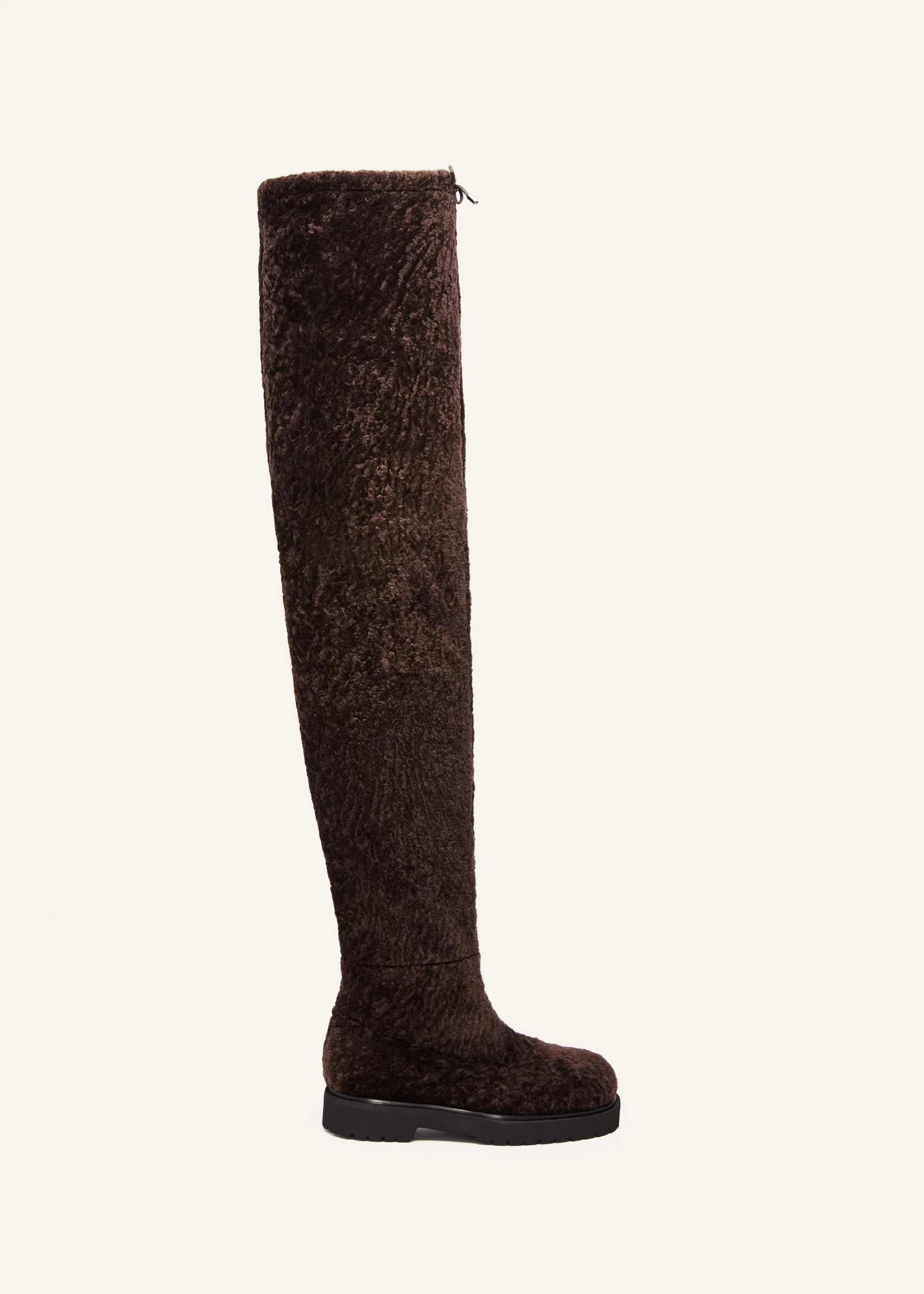 Thigh-high fur boots in brown