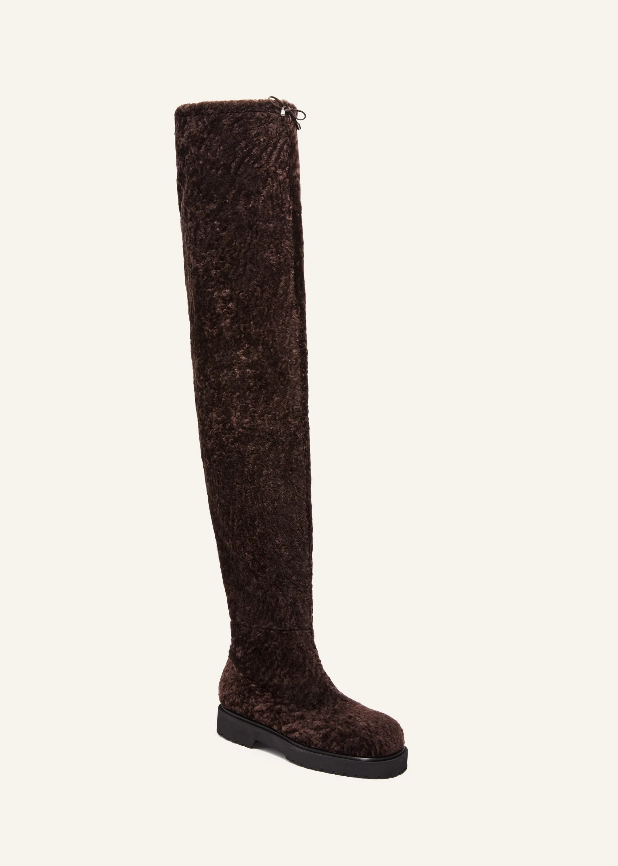 Thigh-high fur boots in brown