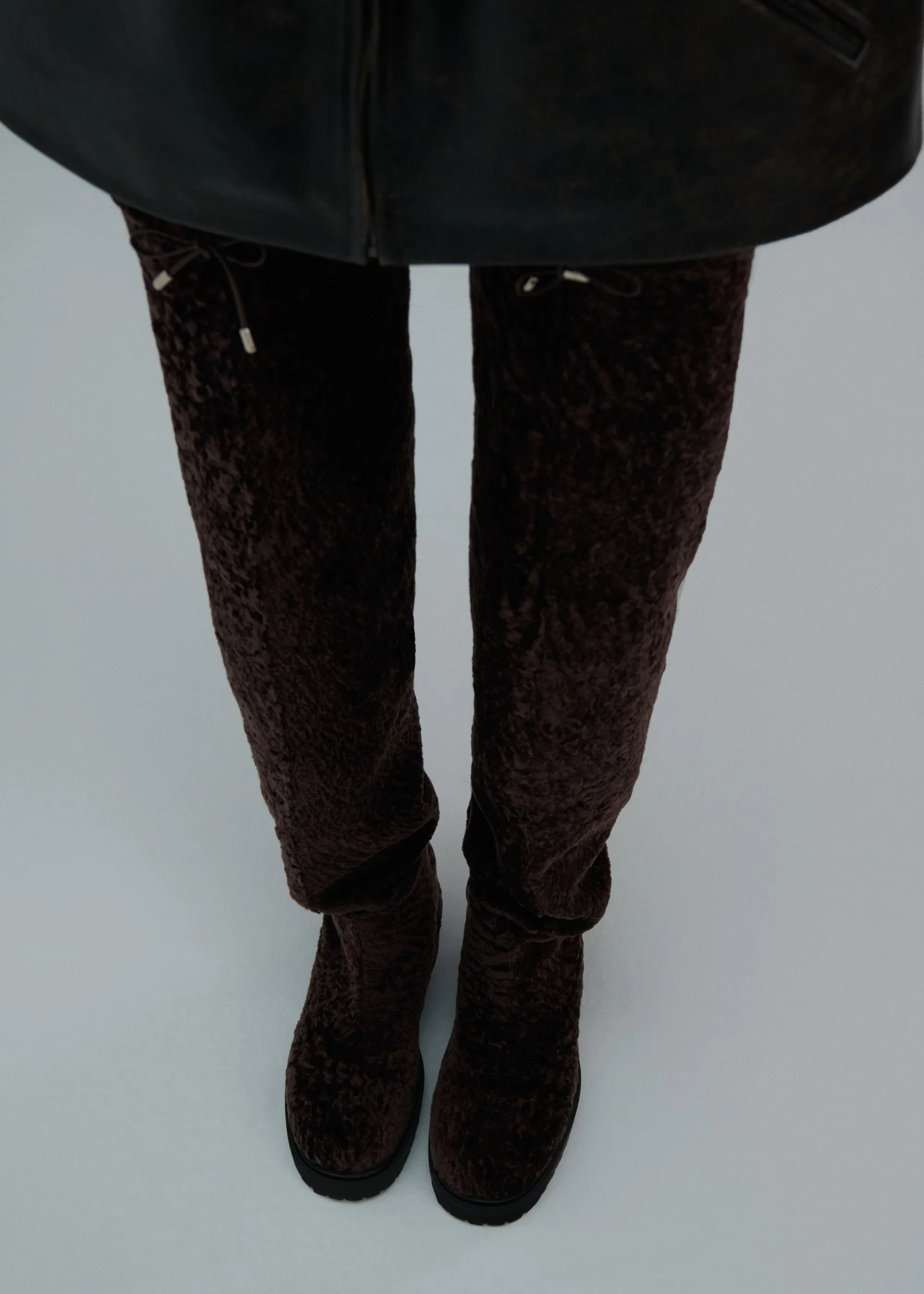 Thigh-high fur boots in brown